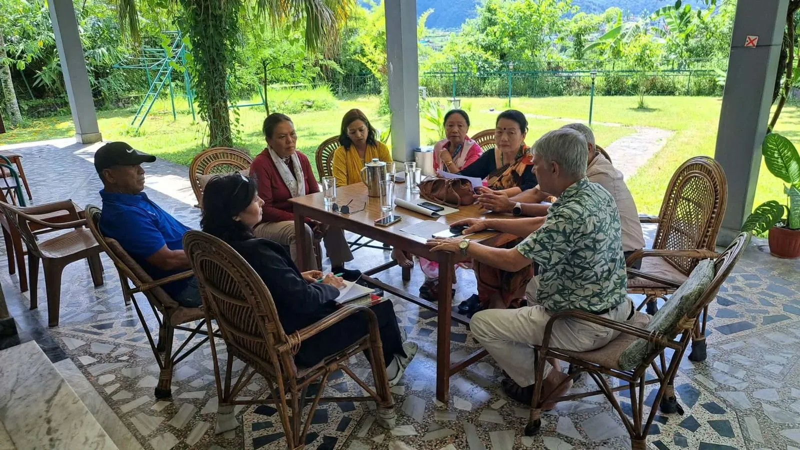 Residents gathered at a garden table